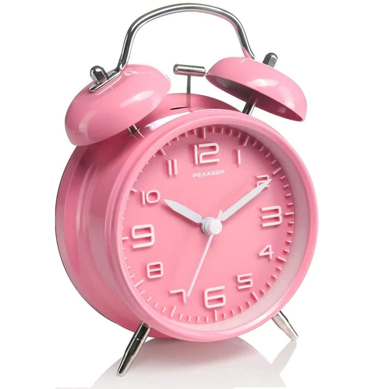 pink Classic alarm clock showing twin bell mechanism and hammer design
