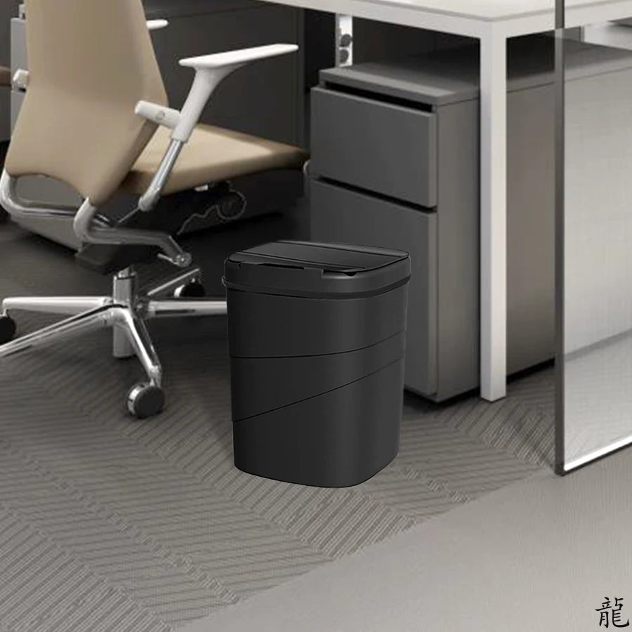 Rectangular touchless trash bin positioned against wall in clean bathroom