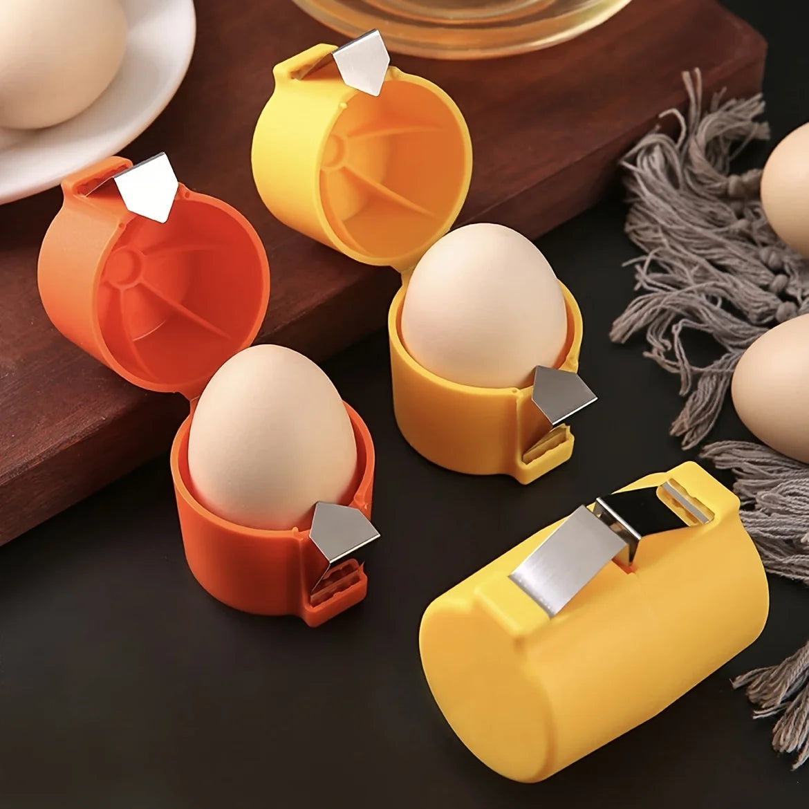 Kitchen egg cracker demonstrating clean shell separation without fragments
